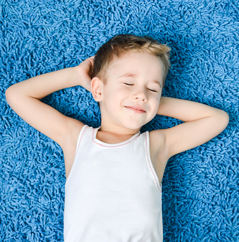 Kid Laying on Carpet